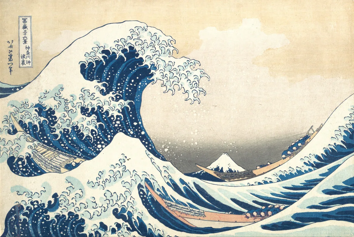 Hokusai woodblock print of a towering blue wave curling over boats with Mount Fuji in the distance.