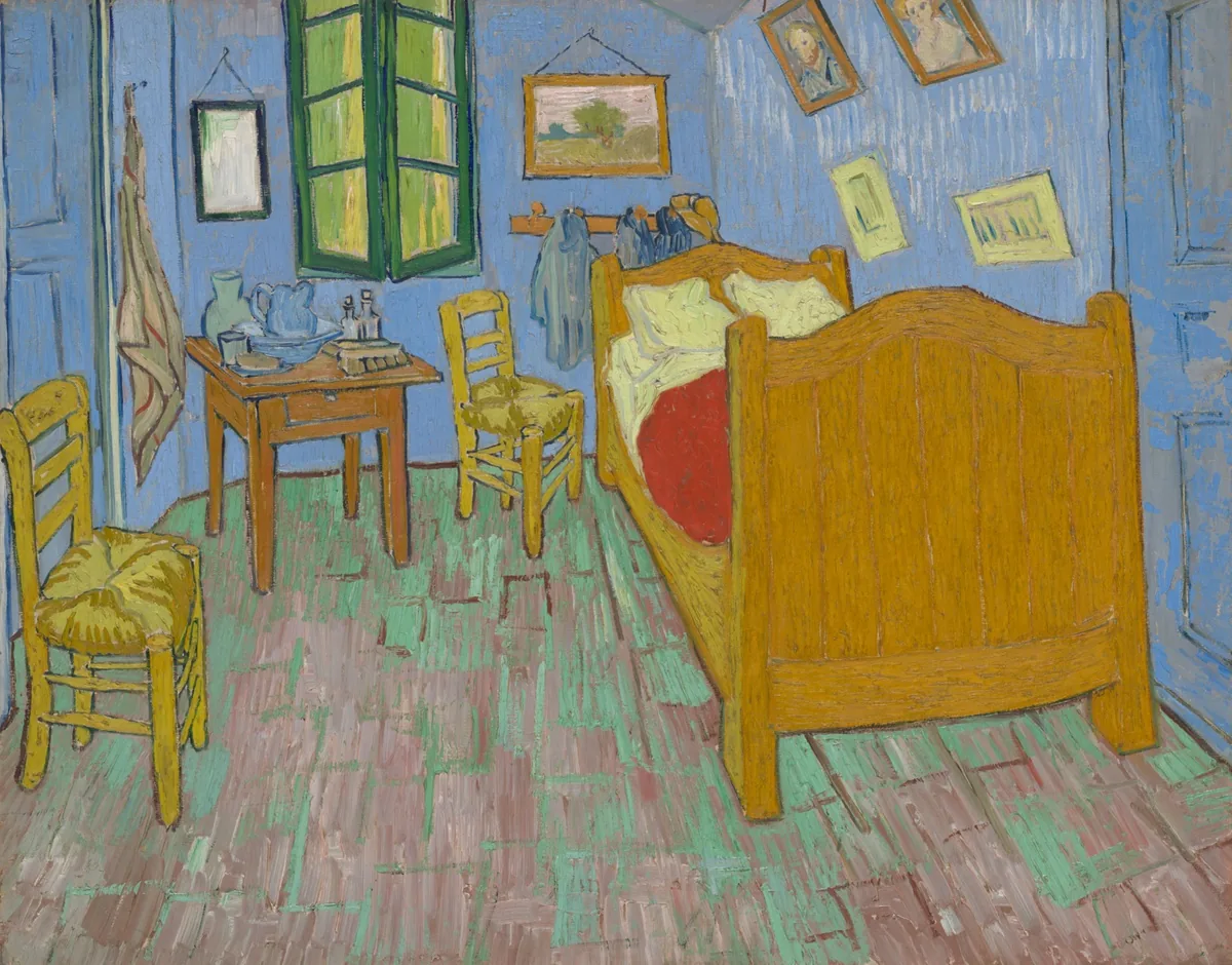 Van Gogh painting of a blue-walled bedroom with green window, wooden bed, red blanket, chairs, and pictures.